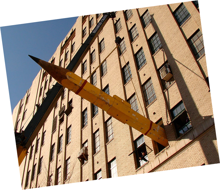 World's Largest Pencil being craned into City Museum window for installation